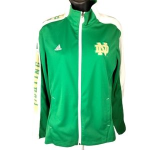Woman Adidias Notre Dame Irish track jacket four leaf clover on side.